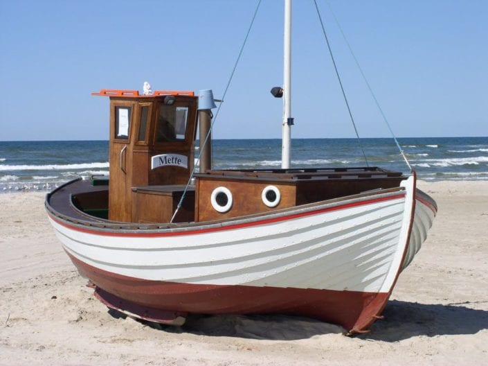 a boat parked on the beach
