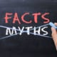 myths on a board crossed out with facts written in red above it