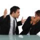 Manager confronting employee in workplace retaliation situation