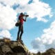 a photographer on top of hill taking a picture
