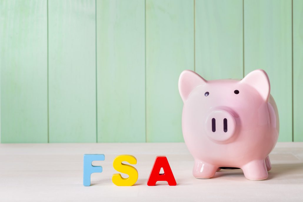 FSA lettes next to a pink piggy bank