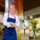 a chef standing outside infront of her restaurant
