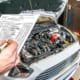 a car mechanic inspecting a car