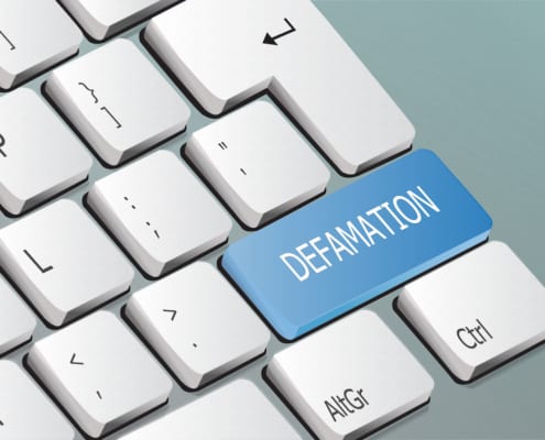 defamation written on a keyboard key