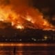 a fire spreading across mountains