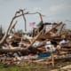 the remains of a house after a tornado