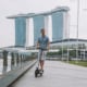 a man driving around on a scooter