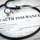 Health insurance claim form with stethoscope on medical paperwork