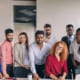 office workers standing together for a group picture