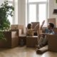 a father daughter surrounded by moving boxes in their new house
