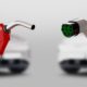 Gas pump nozzle and electric vehicle charging plug side by side