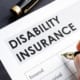 a person filling in a disability form