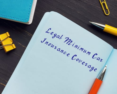a notebook with legal minimum car insurance coverage written on it