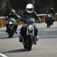 three motorcyclists driving on a road
