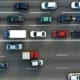 aerial view of a highway with one side jammed and one side moving freely