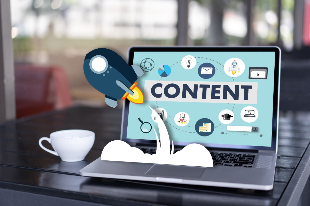 Laptop displaying content marketing strategy with SEO and digital media icons