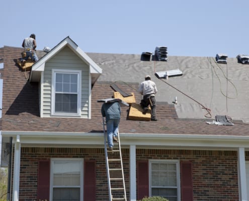 roof crew on a roof installing a new roof