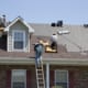 roof crew on a roof installing a new roof