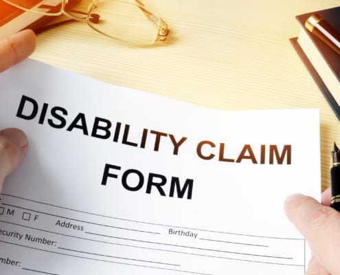 a person holding a disability claim form