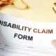 a person holding a disability claim form