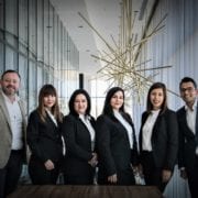 a office team standing in suit looking at the camera