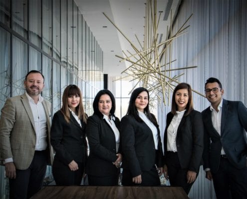 a office team standing in suit looking at the camera