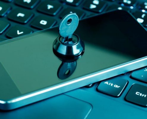 a phone on a laptop with a lock and key on it