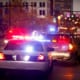 a police car stopping an suv in a police stop