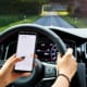 a woman texting and driving