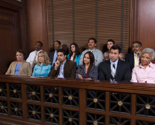 a multi-ethnic jury sitting in a courtroom