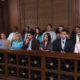 a multi-ethnic jury sitting in a courtroom