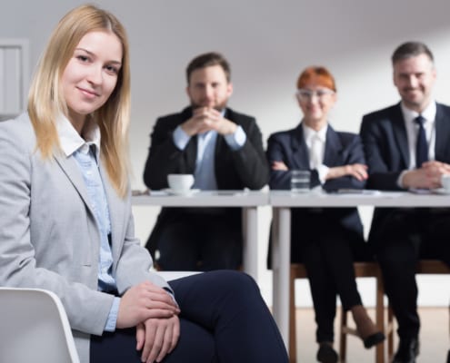a woman in an interview while looking at the camera