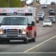 an ambulance driving down the road