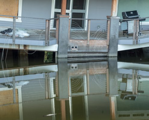 a house slanting because of a sinkhole on the back