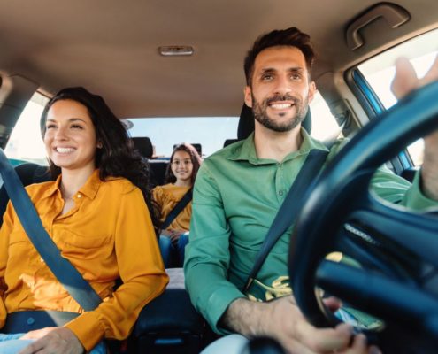 a family driving in their car