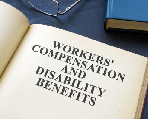 a book with work compensation and disability benefits written on the page